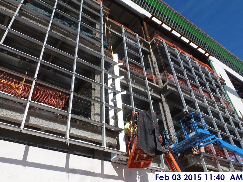 Installing curtain wall mullions at the South Elevation